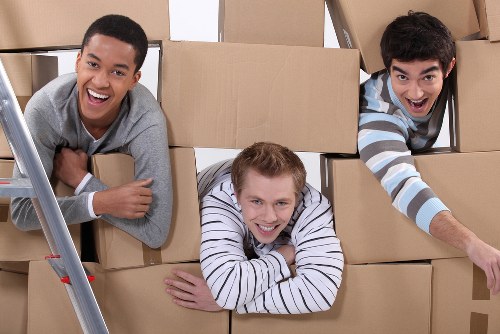 Packed moving boxes and furniture ready for removals in Northockendon