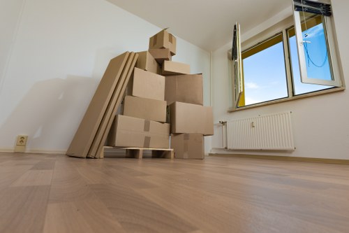 Professional movers handling furniture for a small removal job